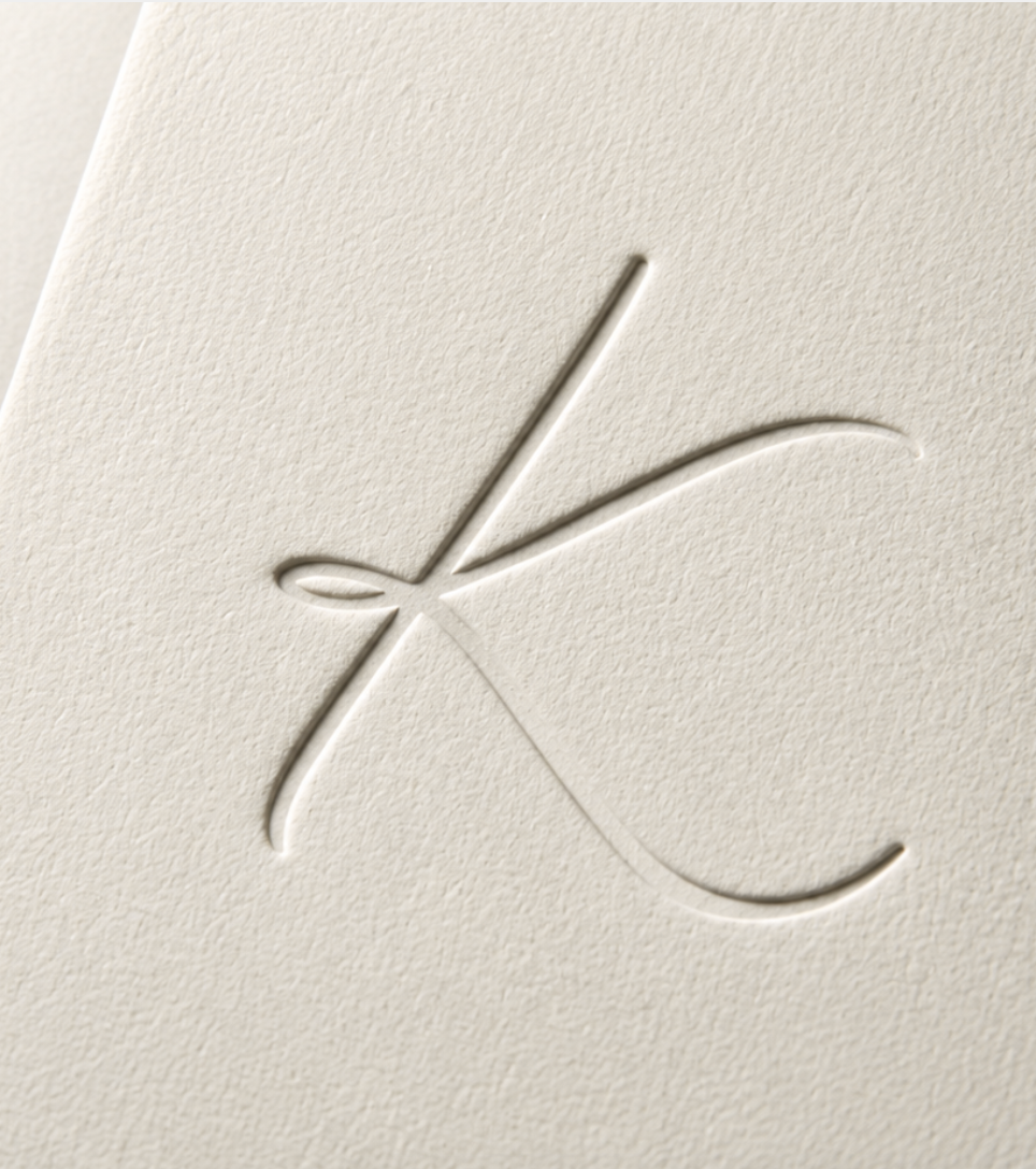 The monogram, blind-pressed