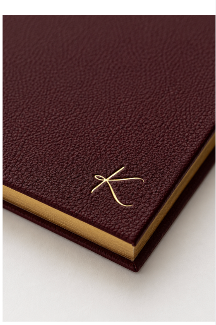 The K, blind-tooled on the corner