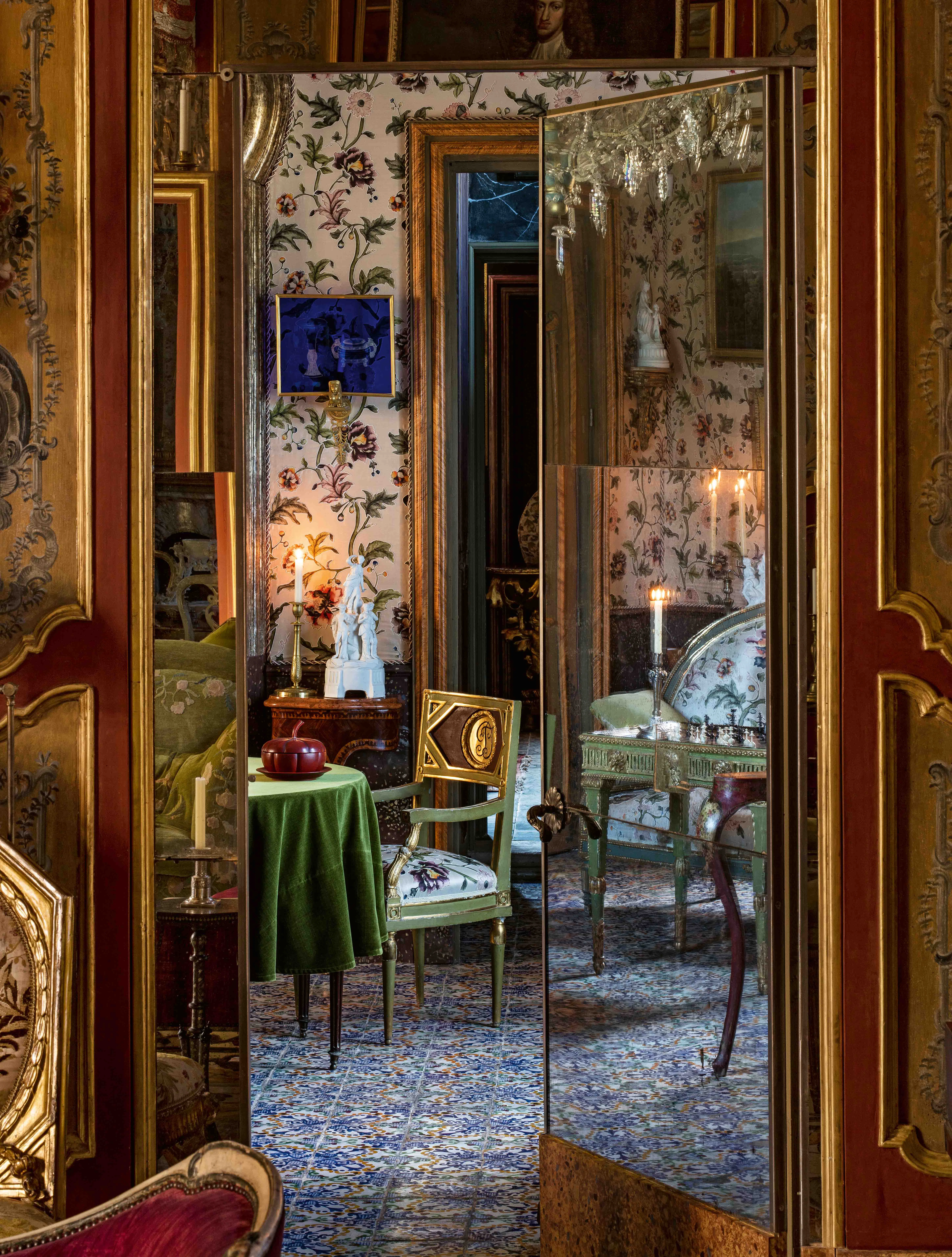 A mirrored doorway, by candlelight